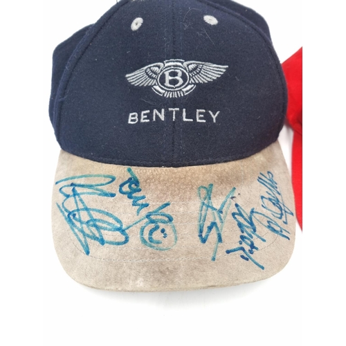 304 - Two motor racing caps, one Ferrari and one signed Bentley