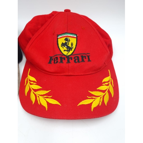 304 - Two motor racing caps, one Ferrari and one signed Bentley