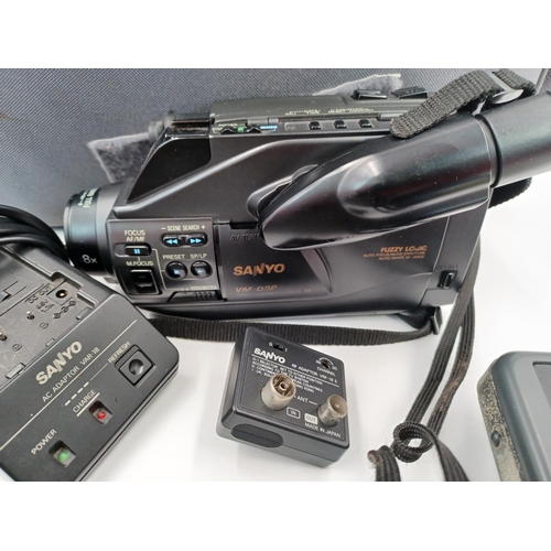 1274 - Three items, one case Sanyo VM-D9P 8mm camcorder with AC and RF adaptors, one pair of Olympus DPC1 8... 