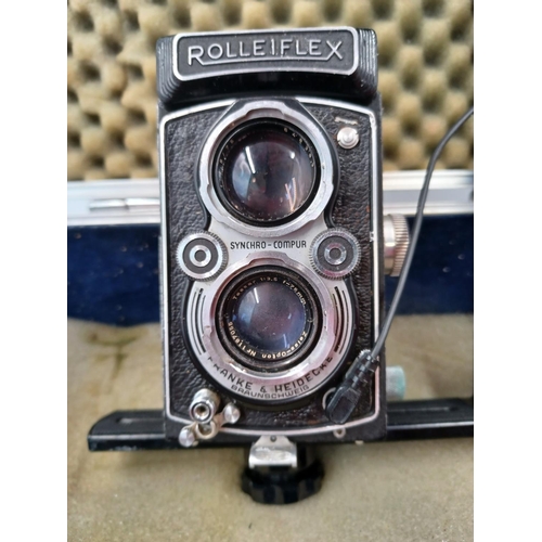 1276 - An aluminium flight case containing Franke & Heidecke Rolleiflex TLR camera fitted with Synchro-Comp... 