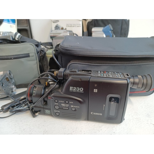 1295 - Two boxes containing a large collection of camcorder equipment to include Philips, JVC, Panasonic, S... 