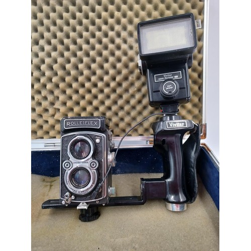 1276 - An aluminium flight case containing Franke & Heidecke Rolleiflex TLR camera fitted with Synchro-Comp... 