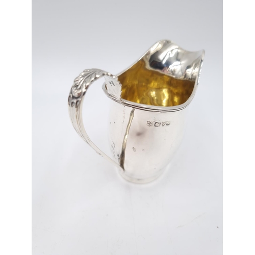 334 - An Edwardian hallmarked Chester silver creamer by George Nathan & Ridley Hayes, dated 1909 - approx.... 