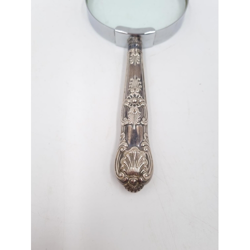 339 - A hallmarked sterling silver handled magnifying glass - approx. 17cm long x 7.5cm diameter