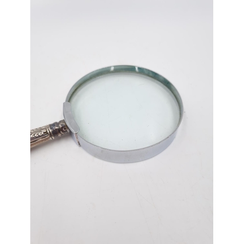 339 - A hallmarked sterling silver handled magnifying glass - approx. 17cm long x 7.5cm diameter