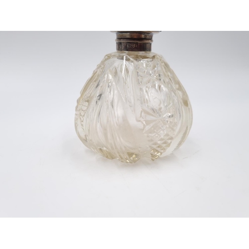 351 - An Edwardian cut glass scent bottle with hallmarked Chester silver collar, dated 1909 - approx. 10.5... 