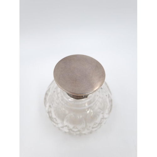 354 - A George V cut glass scent bottle with hallmarked Birmingham collar and lid, dated 1911 - approx. 8c... 