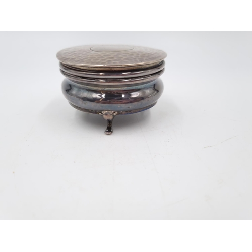 357 - An Edwardian hallmarked Birmingham silver tri footed circular trinket box with blue silk interior, d... 