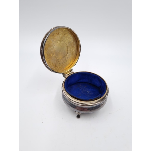 357 - An Edwardian hallmarked Birmingham silver tri footed circular trinket box with blue silk interior, d... 