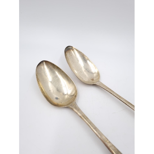 402 - A pair of George III hallmarked London silver table spoons by William Bateman, dated 1815 - approx. ... 