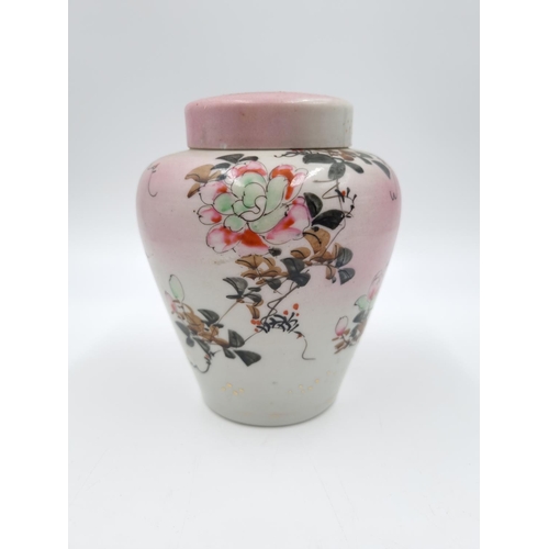 418 - A Japanese porcelain ginger jar and cover decorated with flowers and bird - approx. 14cm high