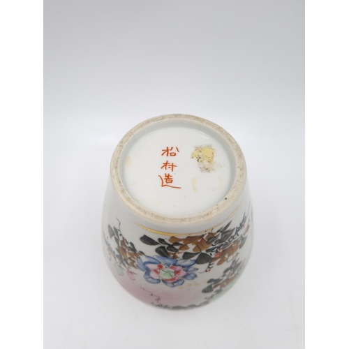 418 - A Japanese porcelain ginger jar and cover decorated with flowers and bird - approx. 14cm high