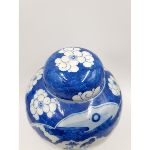 419 - A Chinese blue and white porcelain jar and cover with hardwood circular stand - approx. 20cm high ex... 