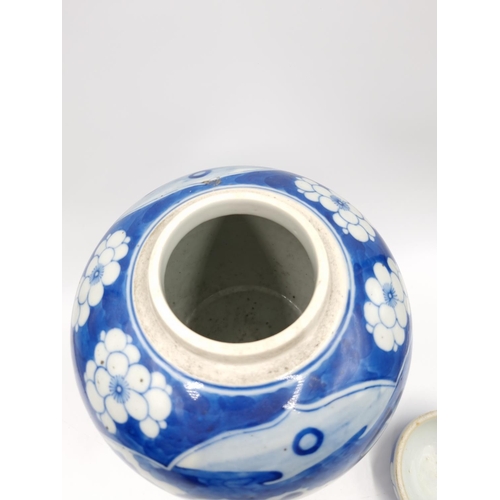 419 - A Chinese blue and white porcelain jar and cover with hardwood circular stand - approx. 20cm high ex... 