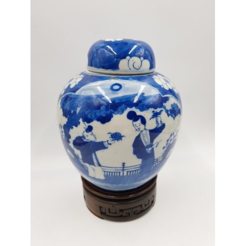 419 - A Chinese blue and white porcelain jar and cover with hardwood circular stand - approx. 20cm high ex... 