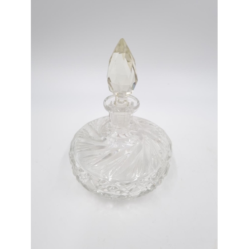 429 - Three cut glass scent bottles, one Stuart Crystal approx. 14cm high and two 11.5cm high