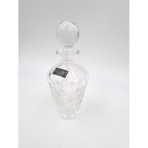 429 - Three cut glass scent bottles, one Stuart Crystal approx. 14cm high and two 11.5cm high