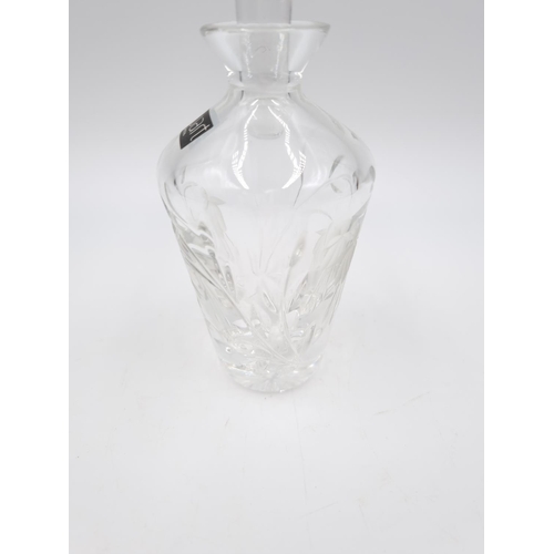 429 - Three cut glass scent bottles, one Stuart Crystal approx. 14cm high and two 11.5cm high