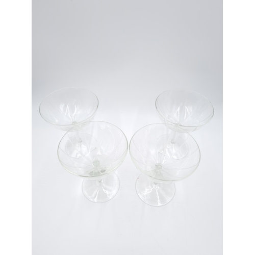 430 - A set of four vintage glass champagne coupes - approx. 12.5cm high x 10cm diameter