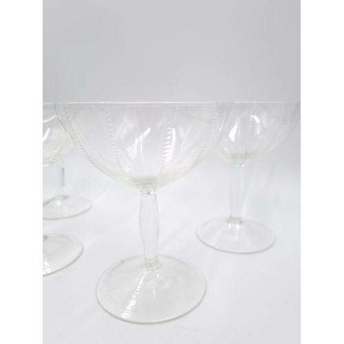 430 - A set of four vintage glass champagne coupes - approx. 12.5cm high x 10cm diameter