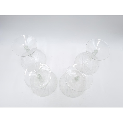 430 - A set of four vintage glass champagne coupes - approx. 12.5cm high x 10cm diameter