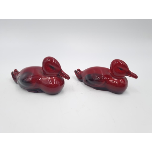 452 - Two Royal Doulton Flambé resting duck figurines - approx. 4cm high x 8cm long