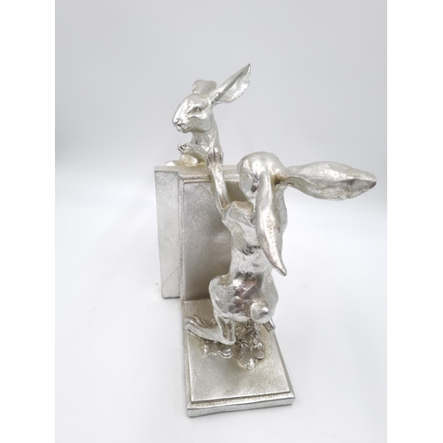 462 - A pair of silver tone hare bookends - approx. 24cm high x 13.5cm wide x 10cm deep