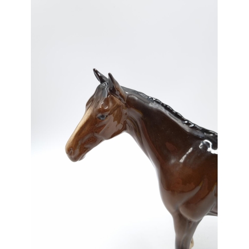 465 - A Royal Doulton brown horse figurine - approx. 20cm high x 25cm long