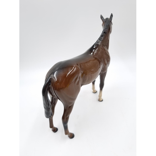 465 - A Royal Doulton brown horse figurine - approx. 20cm high x 25cm long