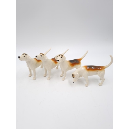 466 - Six Beswick figurines, four fox hounds and two foxes