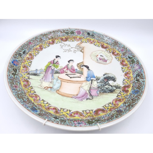 467 - A Chinese Famille Rose porcelain wall charger - approx. 34cm diameter