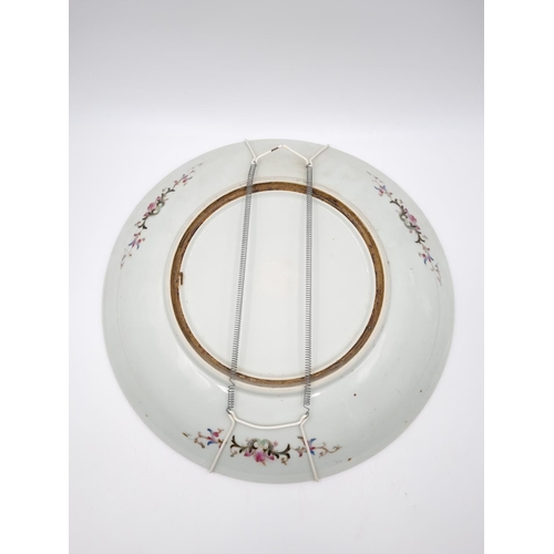 467 - A Chinese Famille Rose porcelain wall charger - approx. 34cm diameter