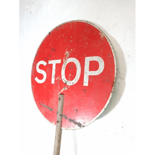 658 - A vintage 'Stop/Go' enamel traffic sign with wooden shaft - approx. 200cm x 60cm in diameter