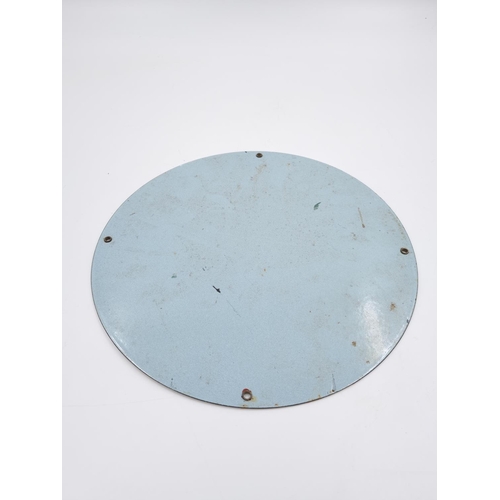 660 - A Capital Airlines enamel sign - approx. 30cm diameter