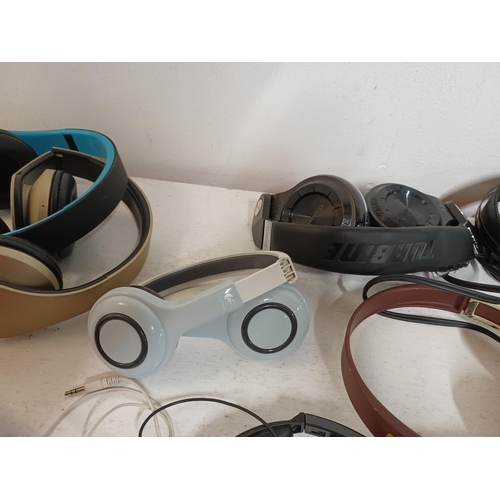 1308 - A large collection of headphones to include eCandy, Skull Candy, JVC, Panasonic RP-WF950H wireless, ... 