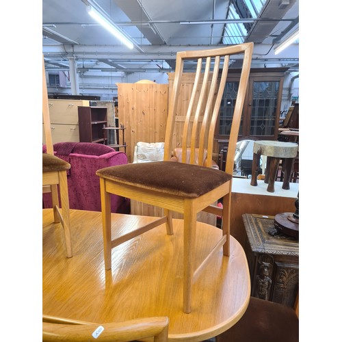 1031 - A 1970s McIntosh teak extending dining table with six matching chairs