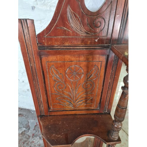 1239 - An Edwardian mahogany framed bevelled edge over mantle mirror - approx. 120cm high x 116cm wide