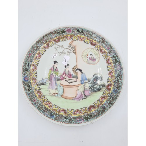 467 - A Chinese Famille Rose porcelain wall charger - approx. 34cm diameter