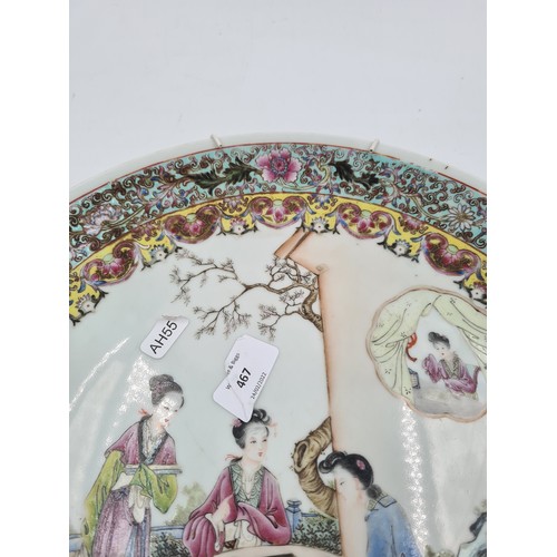 467 - A Chinese Famille Rose porcelain wall charger - approx. 34cm diameter