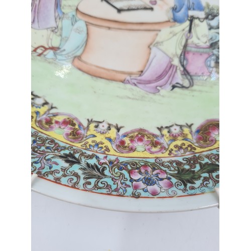 467 - A Chinese Famille Rose porcelain wall charger - approx. 34cm diameter