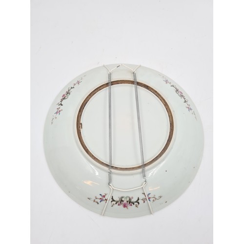 467 - A Chinese Famille Rose porcelain wall charger - approx. 34cm diameter