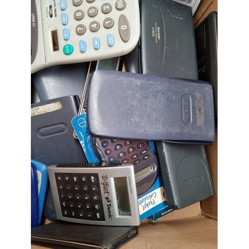 1402 - A box containing a collection of pocket calculators and organisers