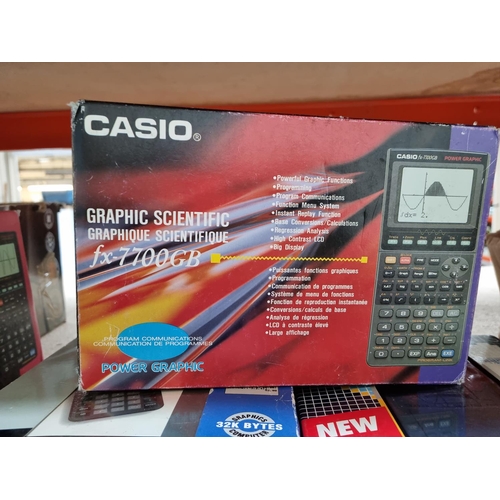 1403 - Seven boxed scientific calculators to include Casio FC-100 financial consultant, Casio FX-770GB grap... 