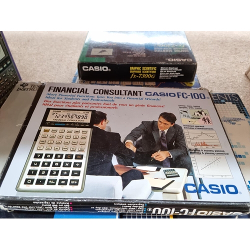 1403 - Seven boxed scientific calculators to include Casio FC-100 financial consultant, Casio FX-770GB grap... 