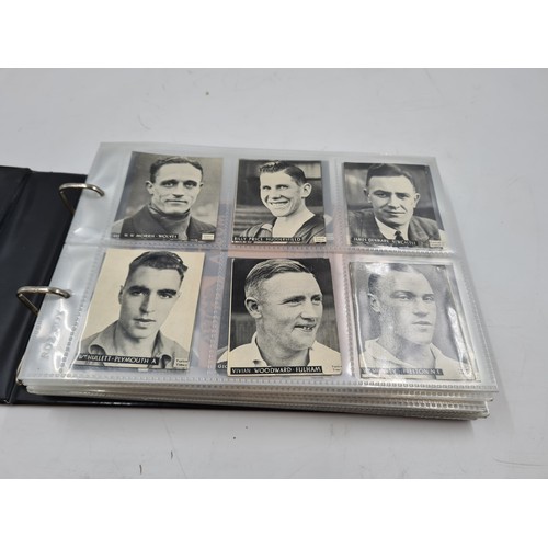 586 - A collection of vintage cigarette cards and photographs to include 1930s Topical Times Stars of Toda... 