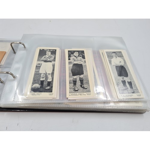 586 - A collection of vintage cigarette cards and photographs to include 1930s Topical Times Stars of Toda... 