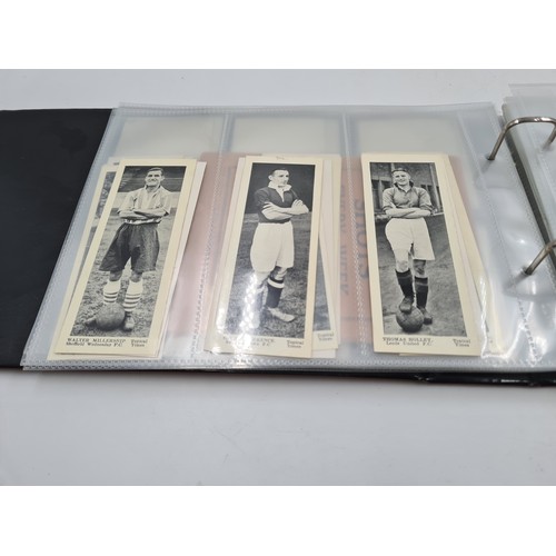 586 - A collection of vintage cigarette cards and photographs to include 1930s Topical Times Stars of Toda... 