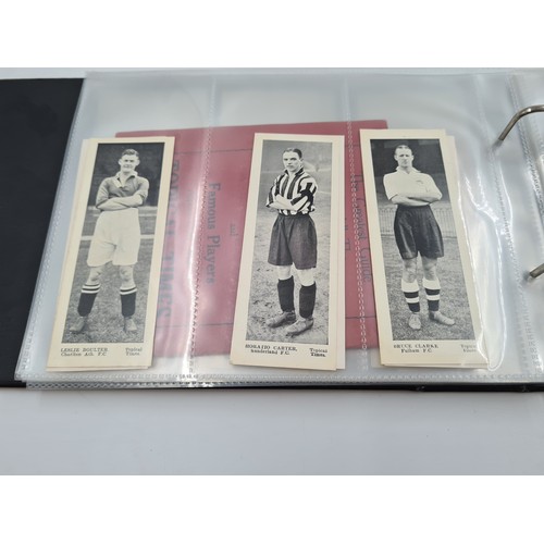 586 - A collection of vintage cigarette cards and photographs to include 1930s Topical Times Stars of Toda... 