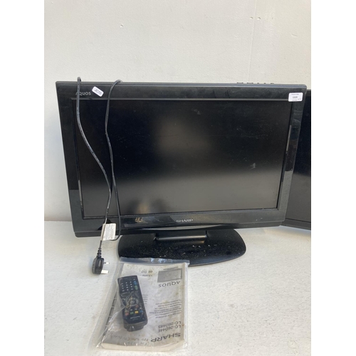 1329 - Two TVs, one Sharp LC-26D44E 26