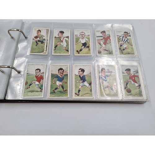 586 - A collection of vintage cigarette cards and photographs to include 1930s Topical Times Stars of Toda... 